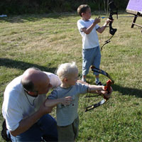 Never to young to start.  Chris Jones gives 2 year old Ethan Jones his first lesson.